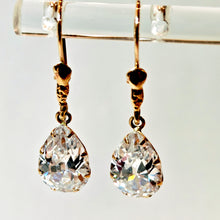 Load image into Gallery viewer, Gold earrings with a large clear stone