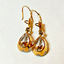 Load image into Gallery viewer, Gold earrings with a large clear stone